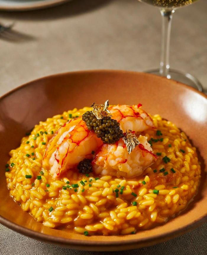 Saffron-Infused Lobster Risotto with Caviar and Gold Leaf