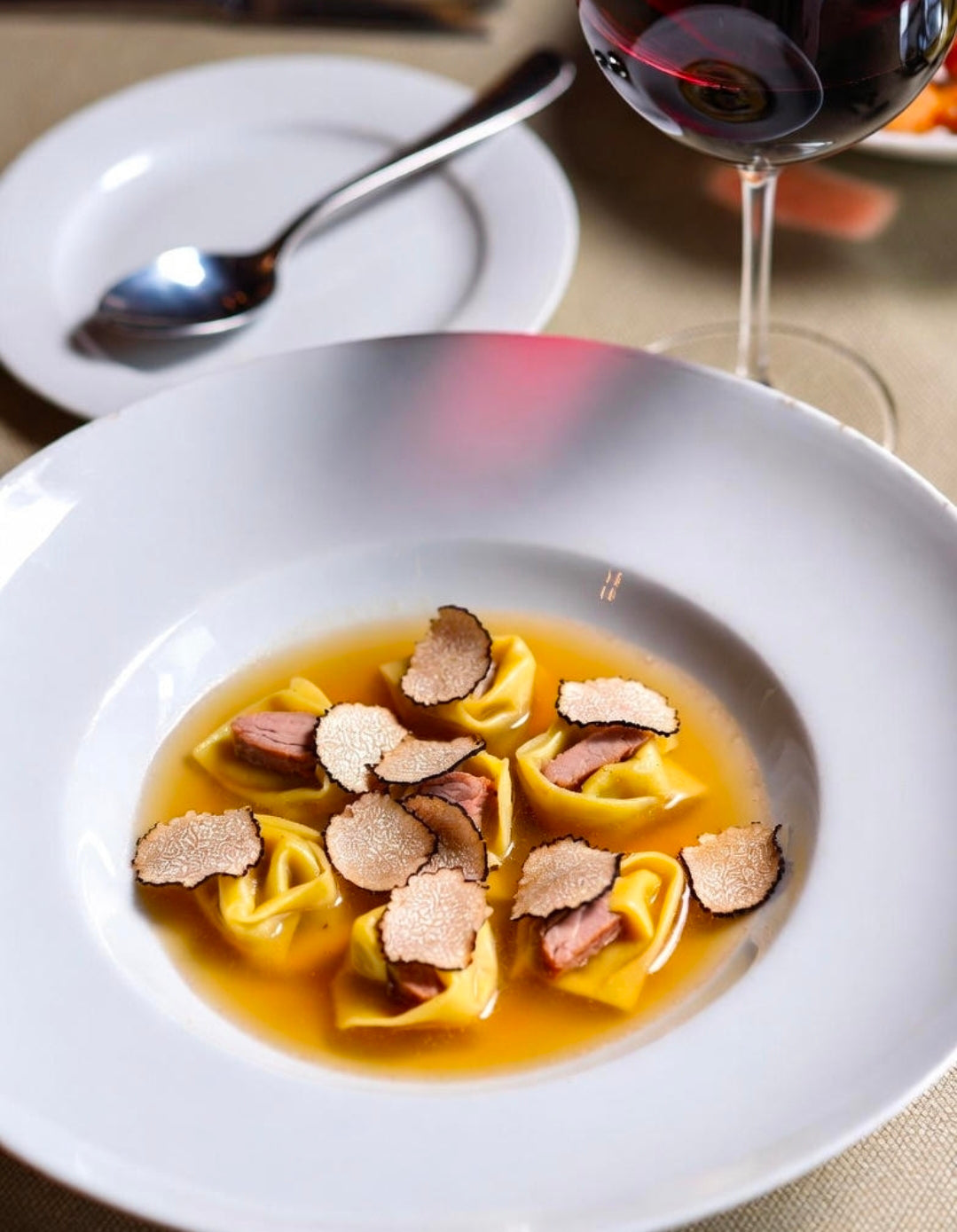 Duck Confit Tortellini in Consommé of Forest Mushrooms