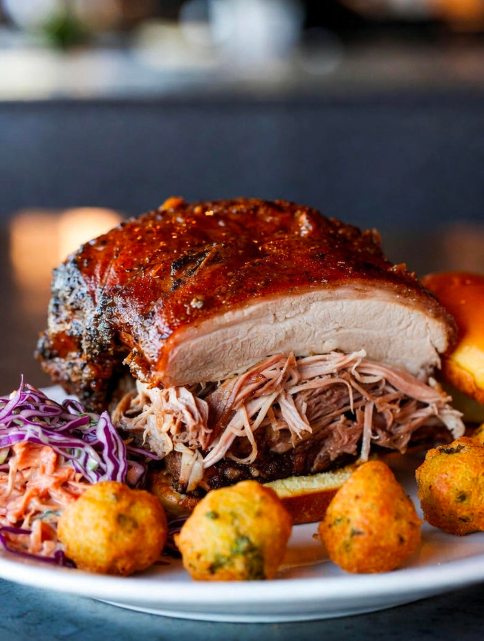 Carolina-Style Pulled Pork Shoulder with THC-Infused Vinegar Mop, Creamy Red Slaw, and Hushpuppy Cornbread Bites