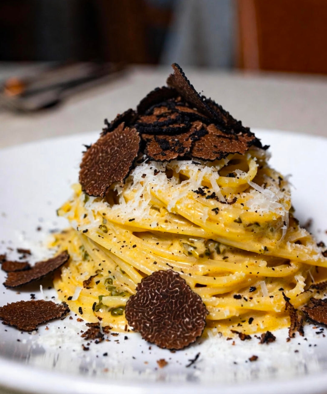 Black Truffle Tagliatelle with Infused Duck Egg Carbonara and 36-Month Parmigiano-Reggiano