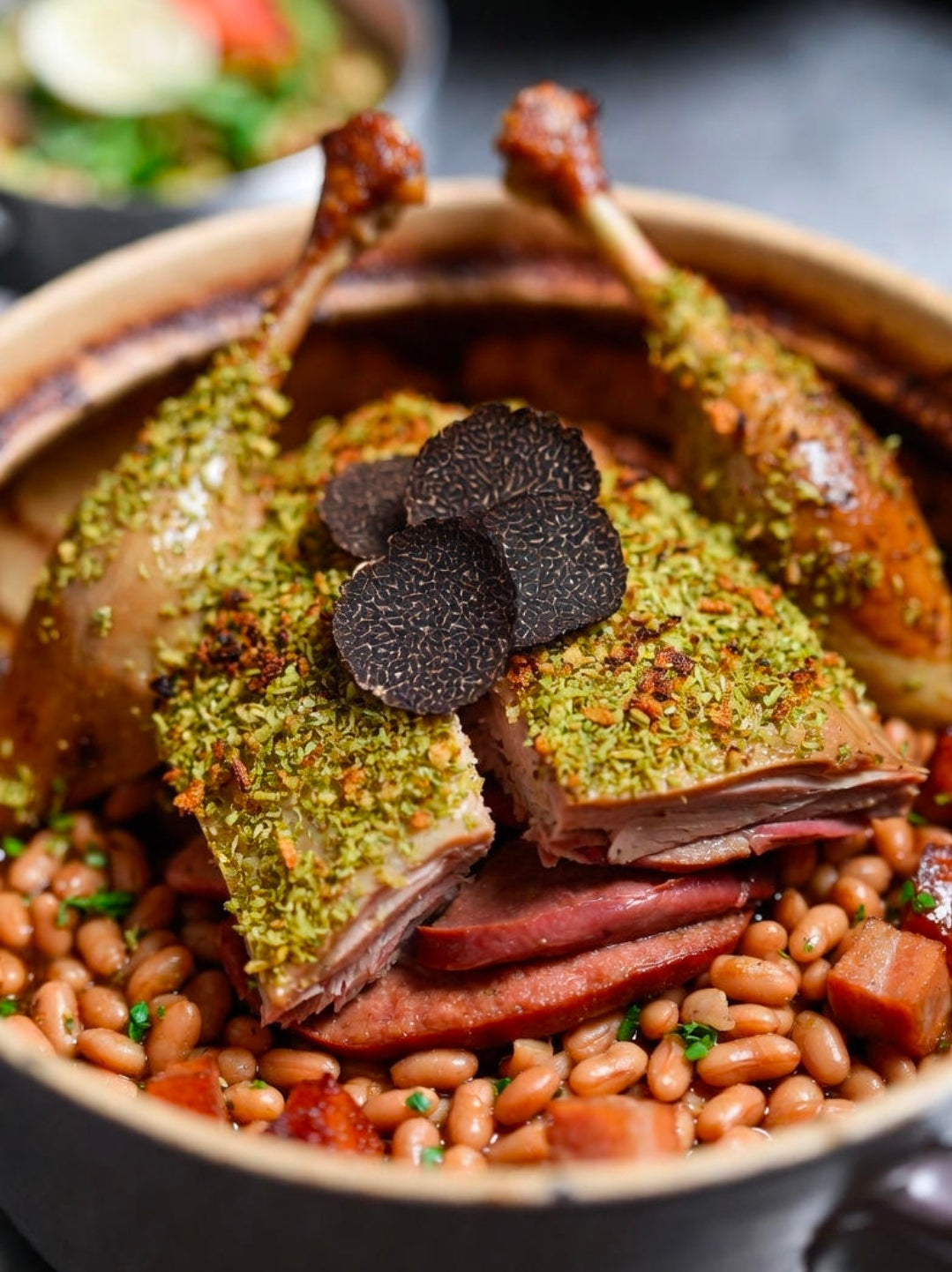 Whole Dry-Aged Duck Confit Cassoulet with THC-Infused Duck Fat Garlic Crumb and Winter Black Truffle