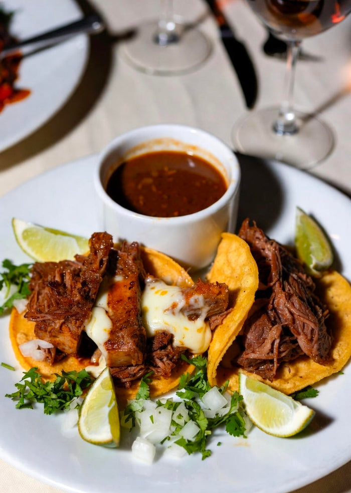 Wagyu Short Rib Birria Tacos with Infused Consommé, Quesillo, and Charred Habanero Salsa